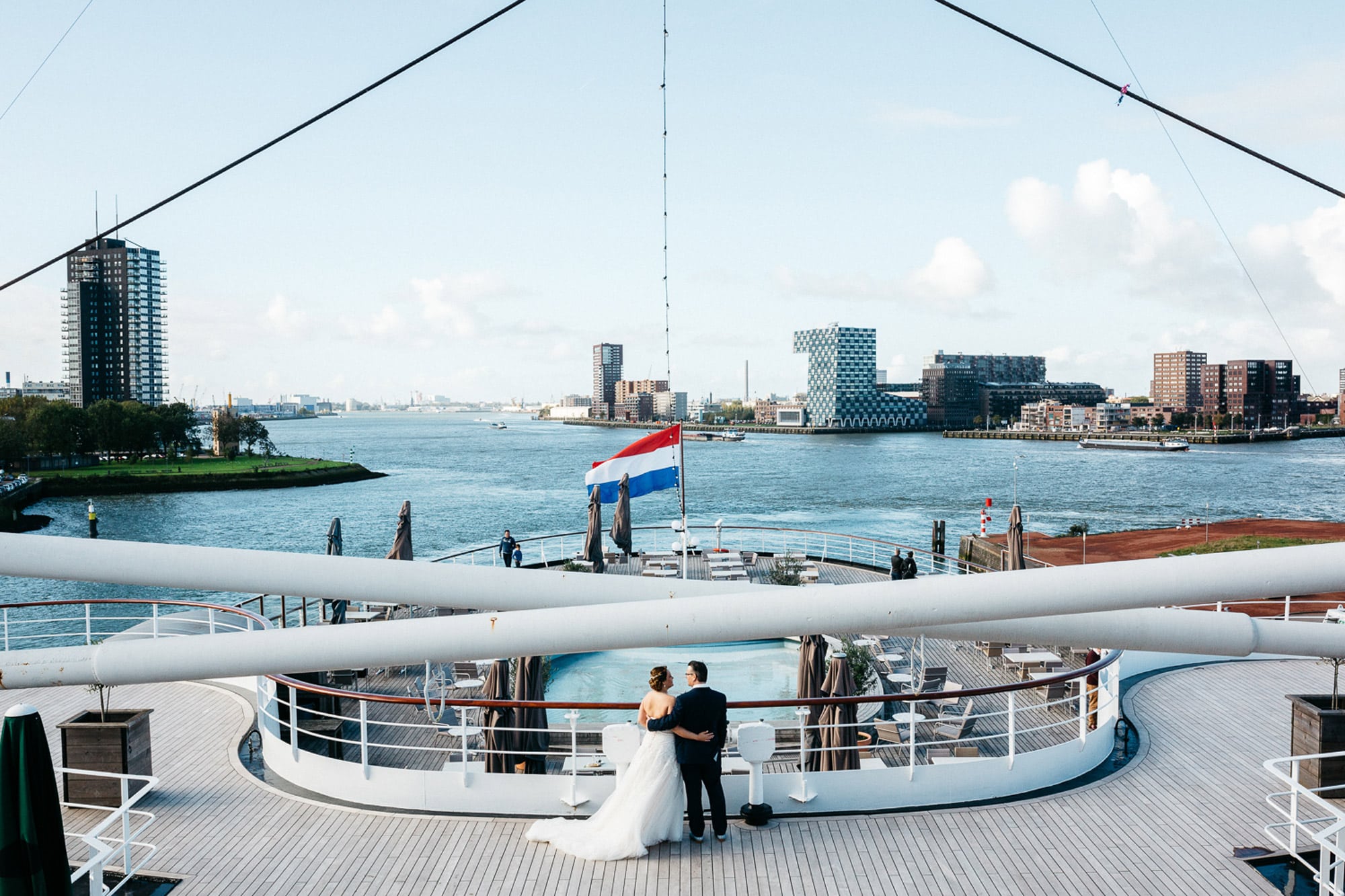 Getting married in Rotterdam - A bride and groom stand on the deck of a cruise ship.