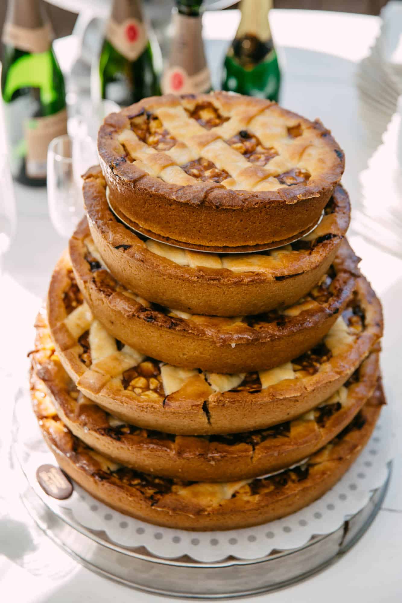 A stack of wedding cakes on a table.