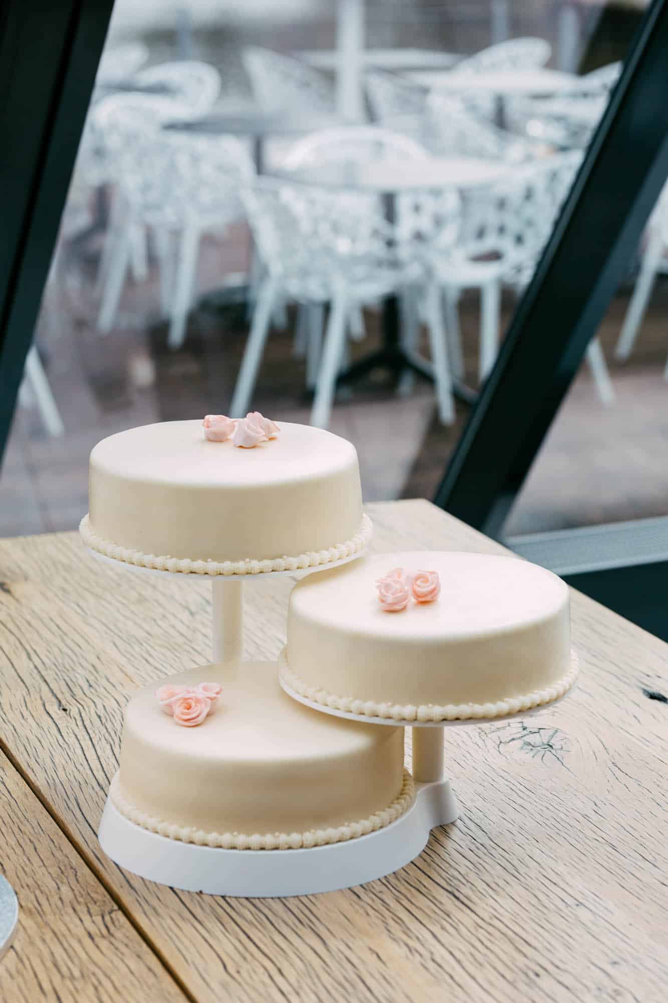 Wedding cakes on a wooden table.
