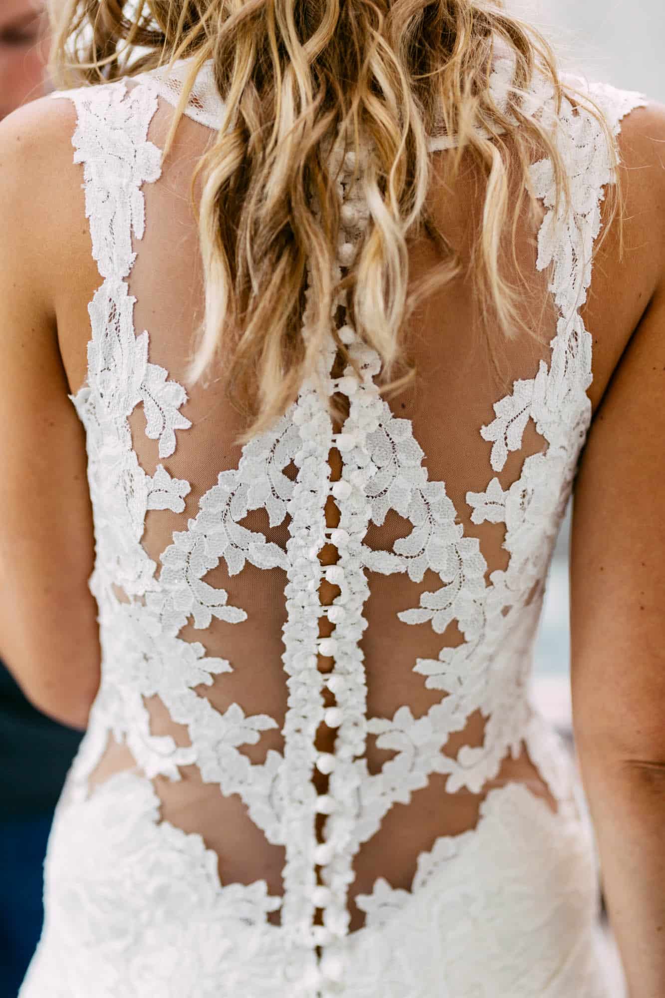 The bohemian look of a bride's wedding dress, with intricate details that showcase the ethereal beauty of a wedding dress.
