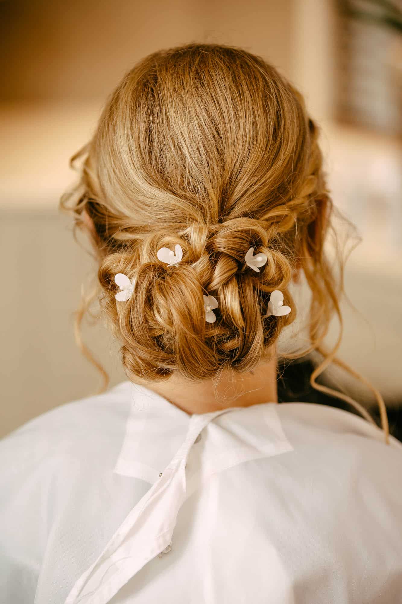 Bridal hairstyles with flowers that gracefully accentuate a woman's hair.