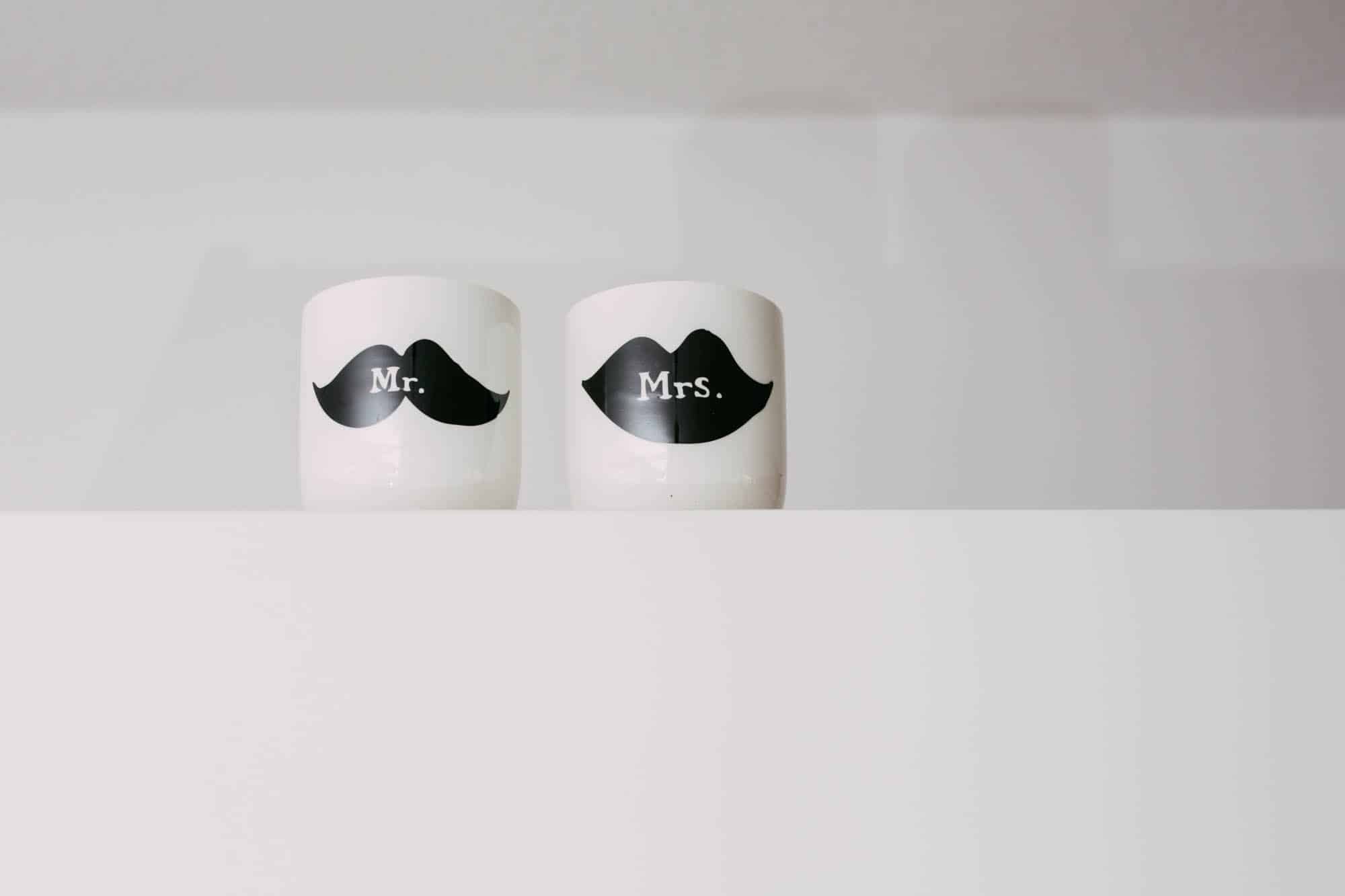 Description: Two black and white mugs with moustaches on them for a wedding day gift.