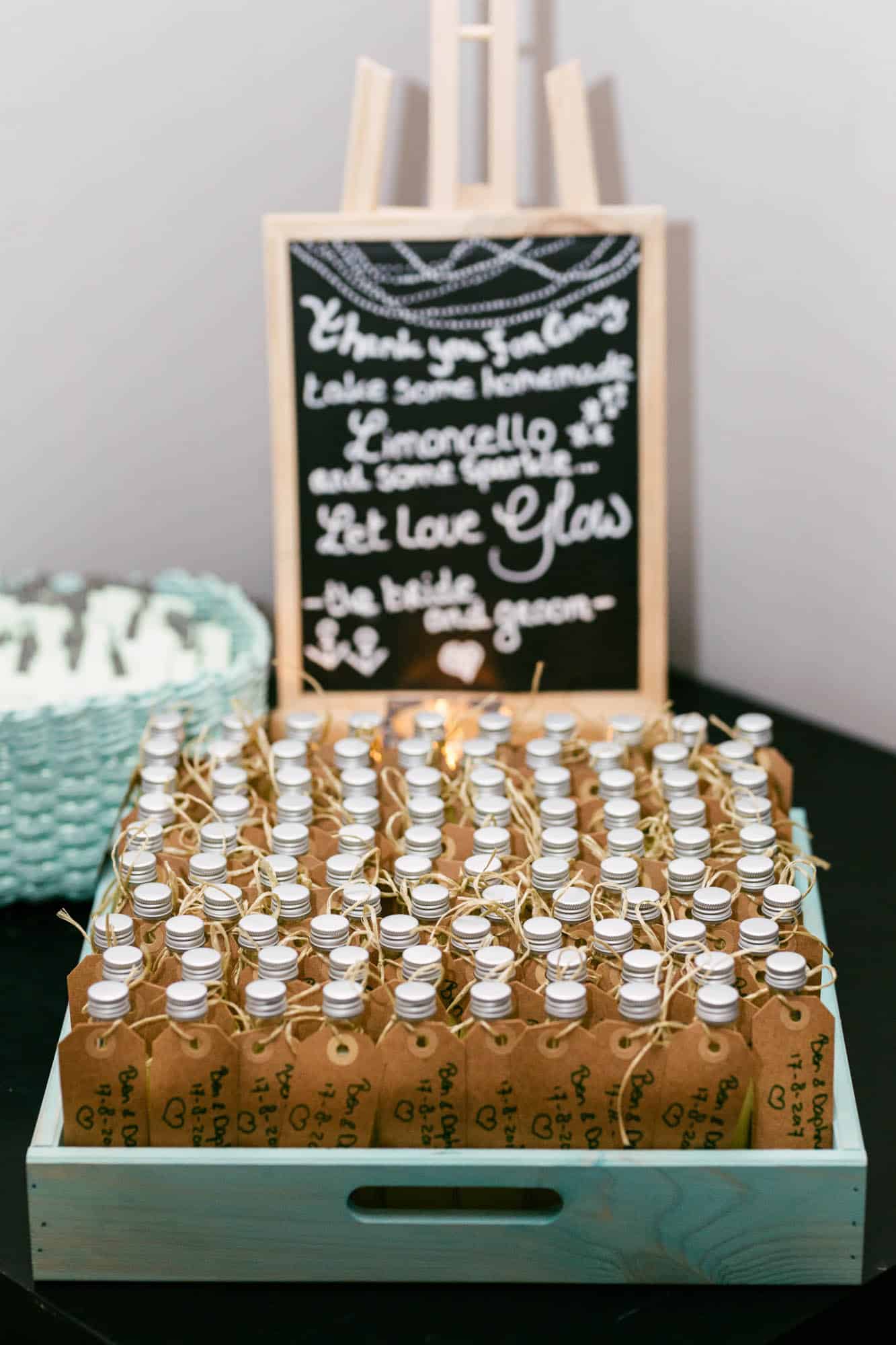 Description: Wedding anniversary gift in bottles with a chalkboard sign.