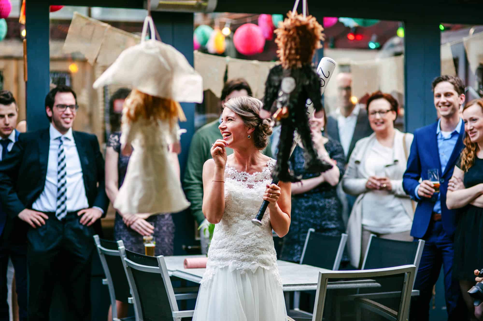 On her wedding day, a bride surprises the audience with an unexpected gift: she holds a doll in front of her.