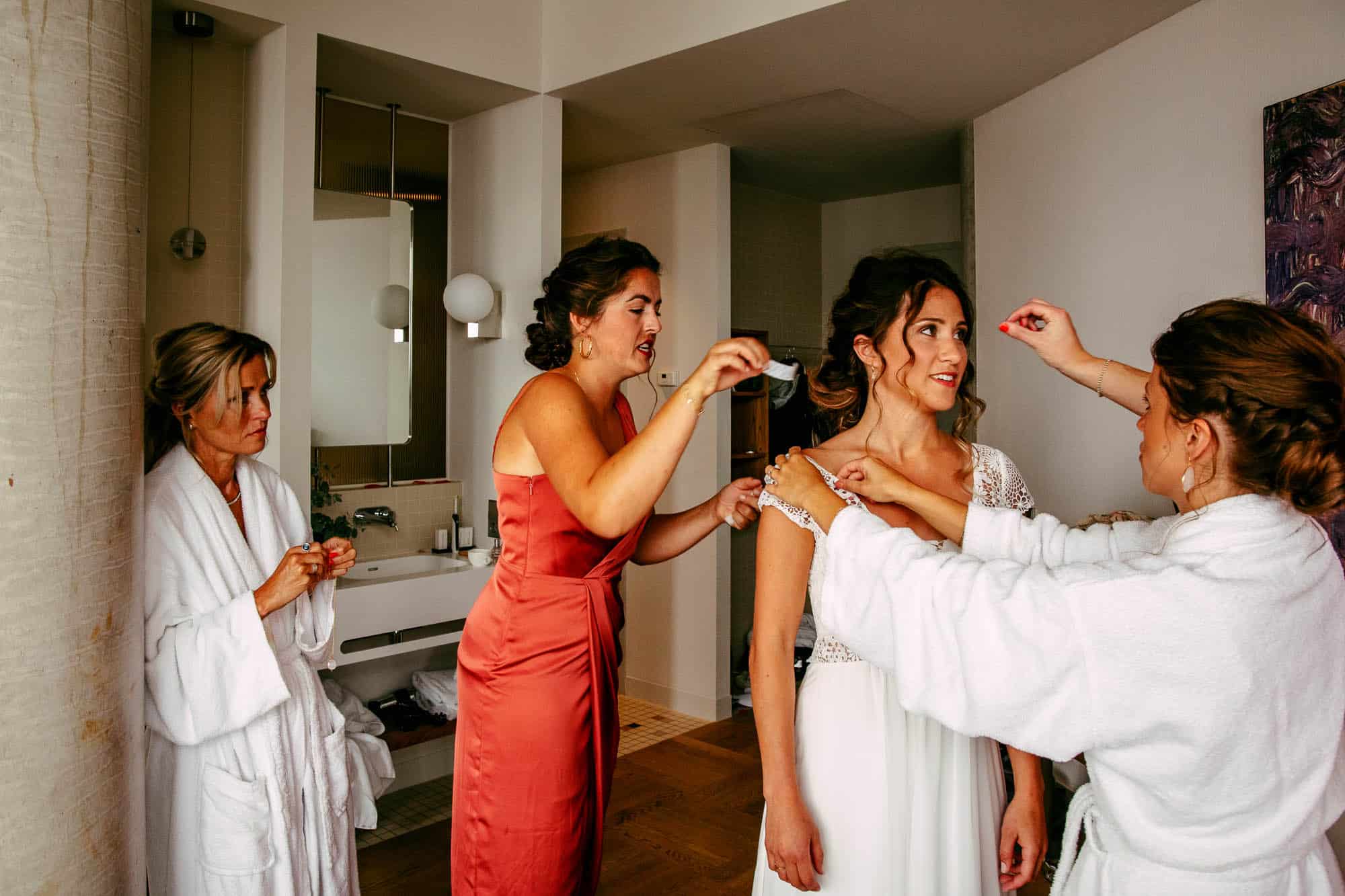A bride and her bridesmaids prepare for the wedding with Bridal Makeup.
