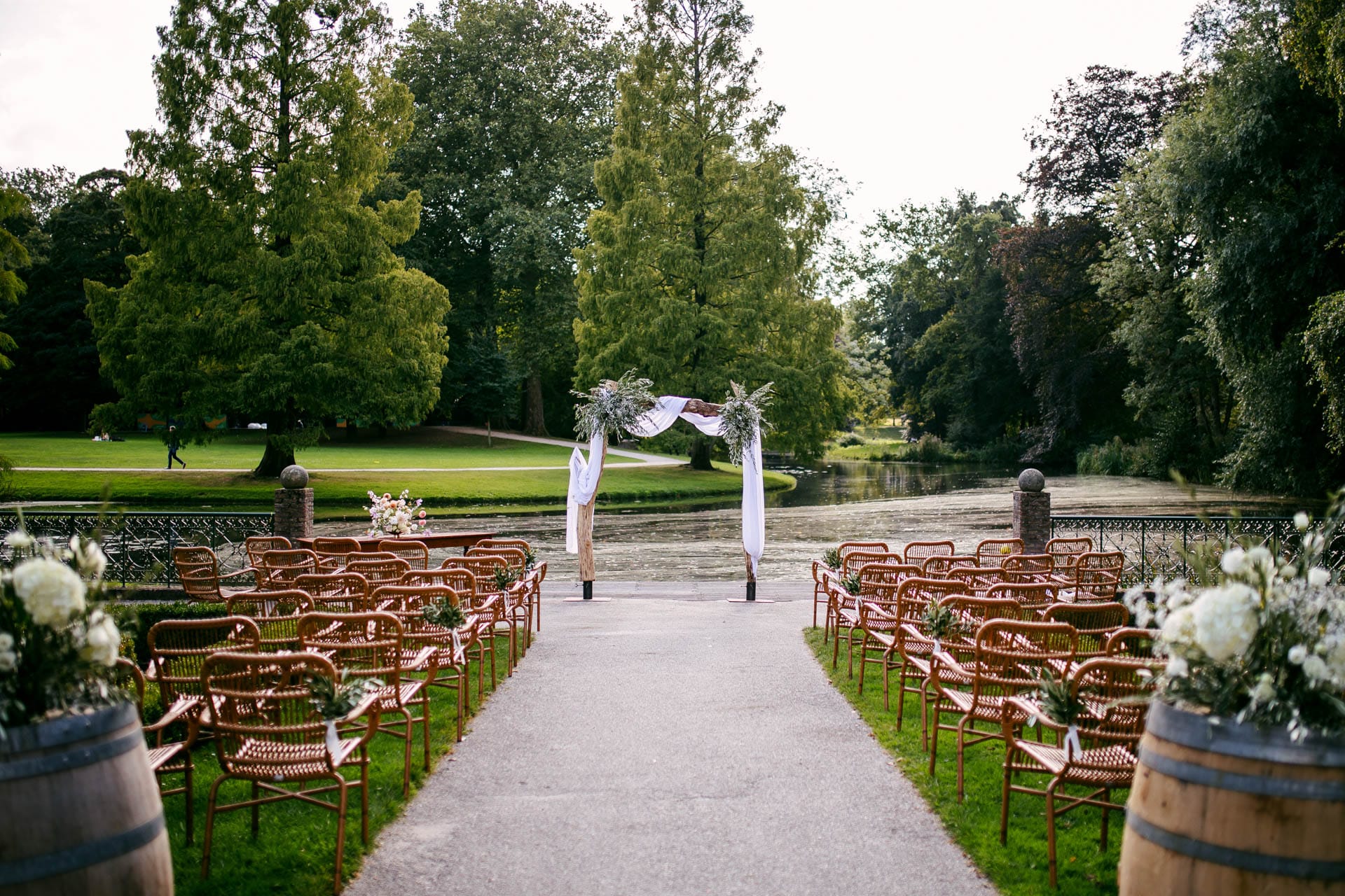 Description: A Wedding in the Woods ceremony set-up with wooden chairs and barrels.