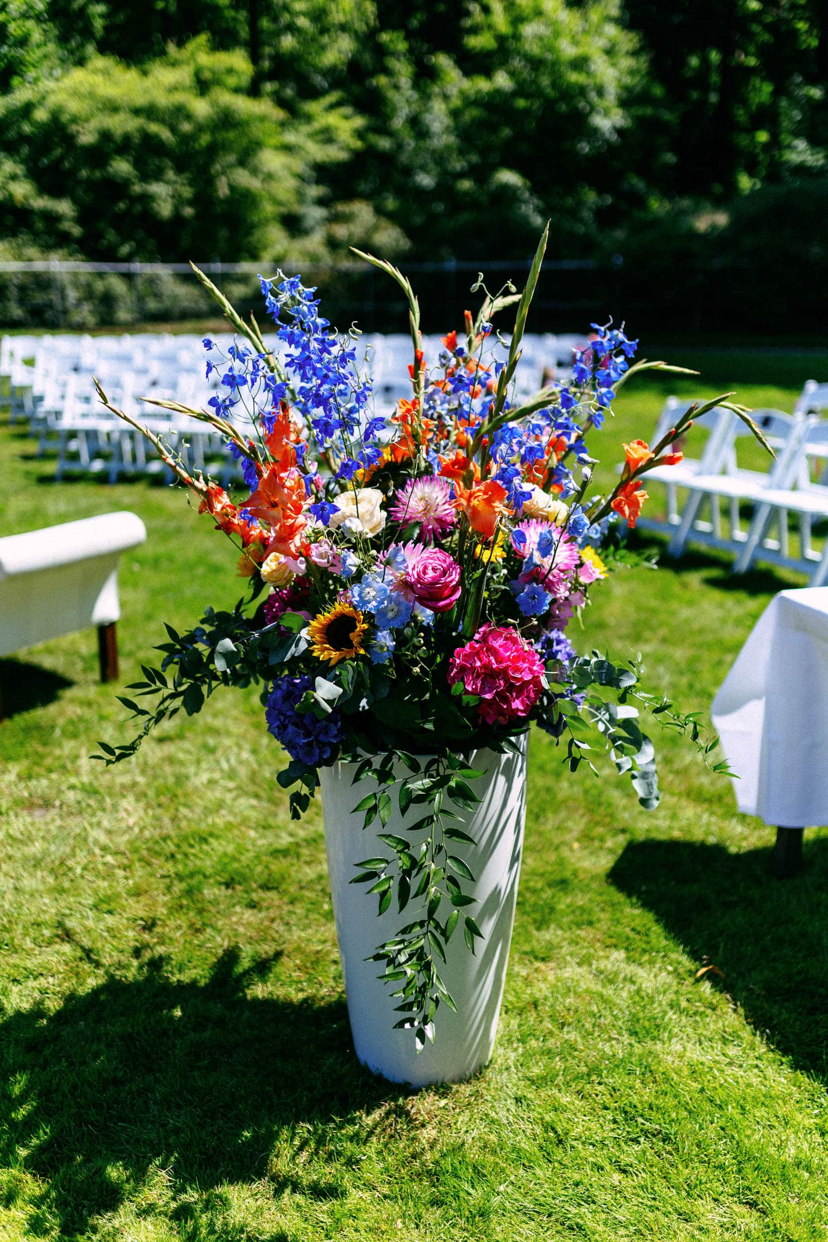 A vibrant bouquet of flowers adorns a lush lawn.