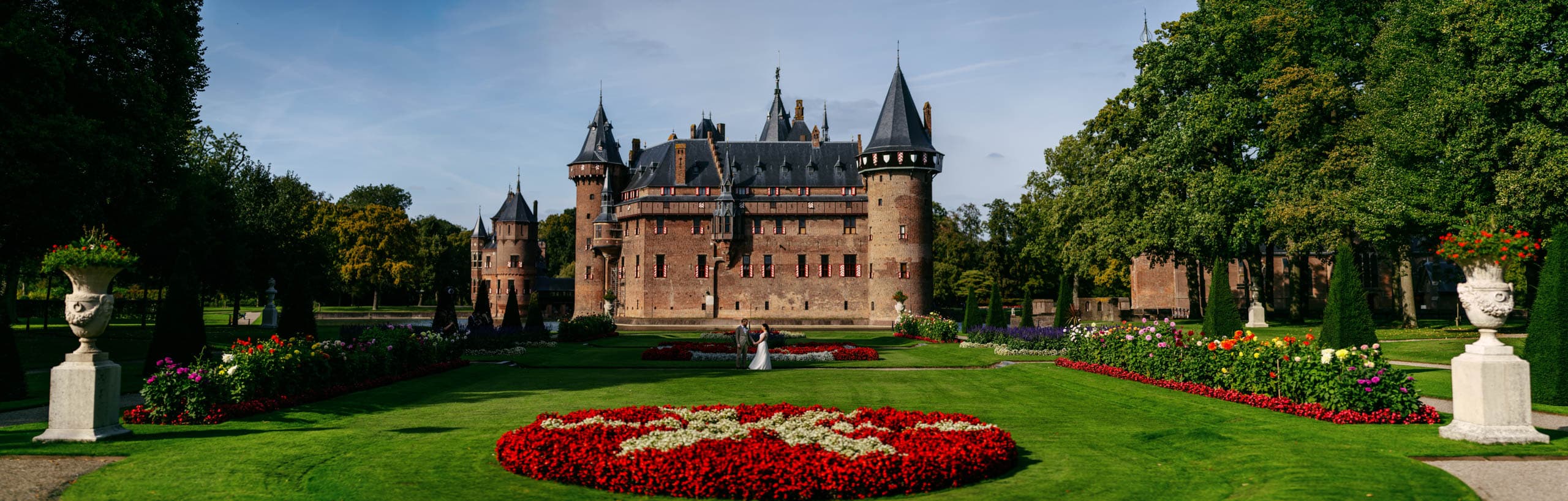 Kasteel de Haar, a large castle set amidst a lush green lawn.