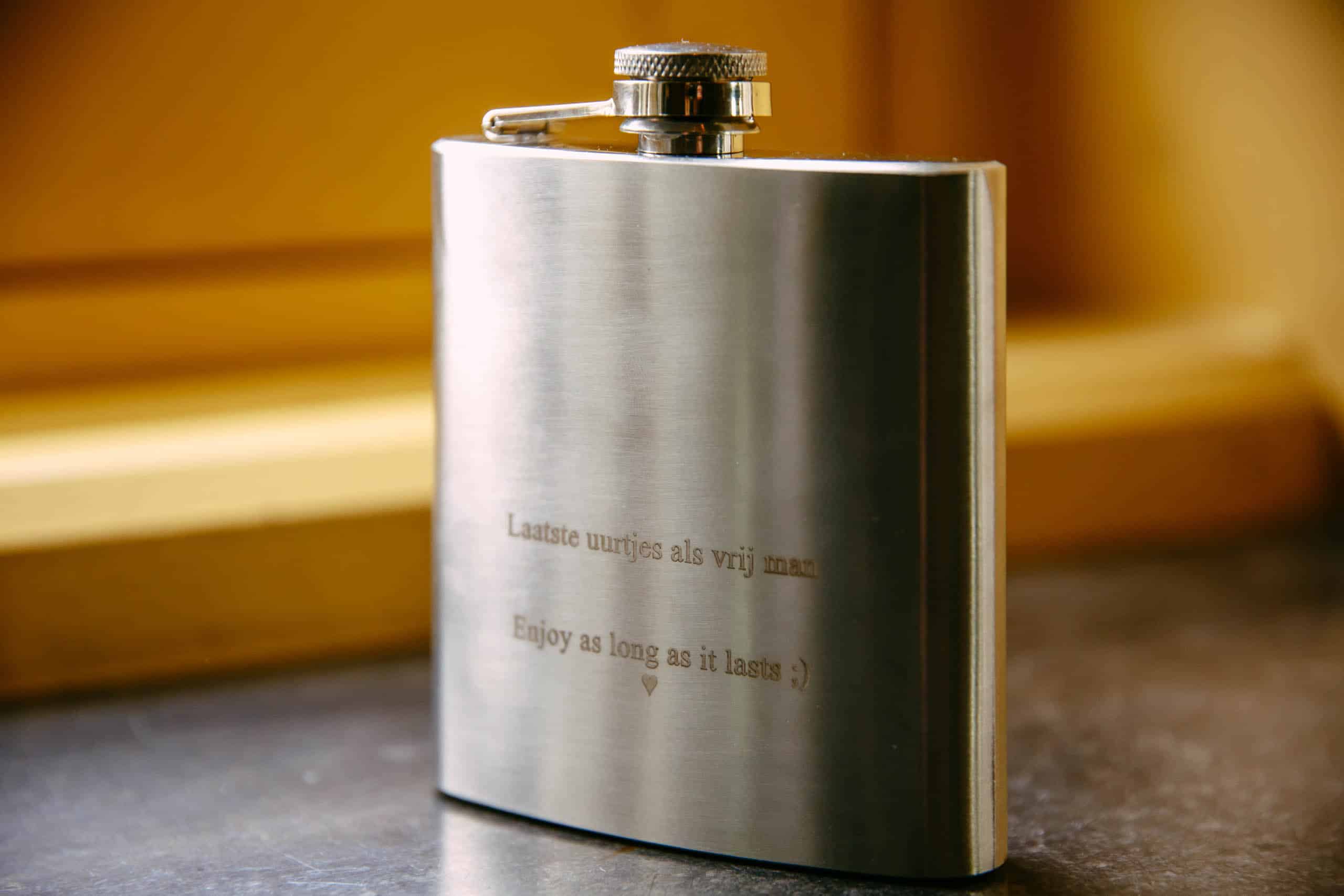 A cosmetic hip flask with a quote on it, ideal as a wedding day gift.