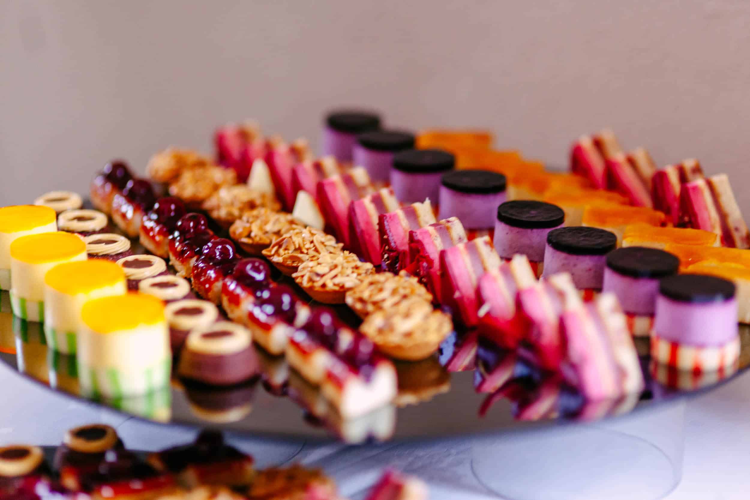 A tray of desserts on the table.