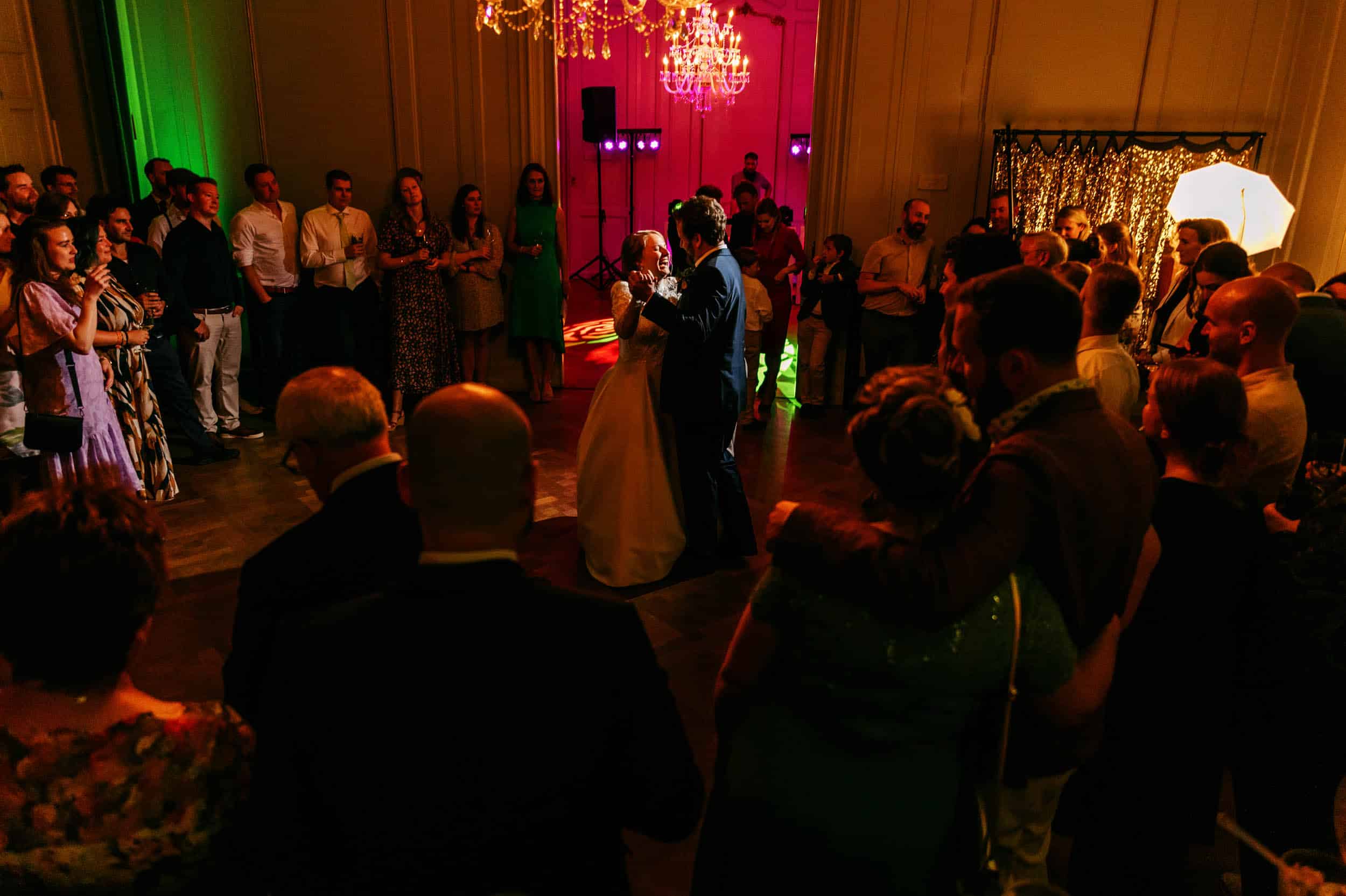 The perfect wedding moment captured by the professional wedding photographer: a bride and groom dancing at their reception.