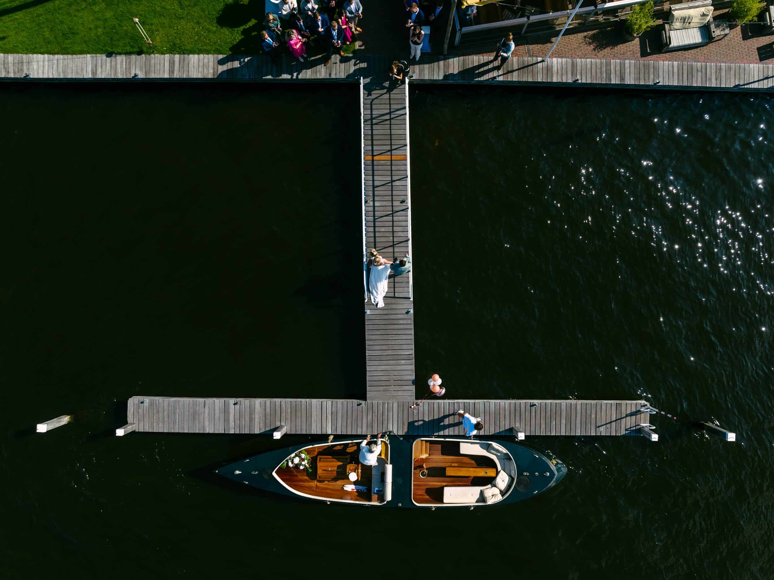 An aerial view of a boat on a dock.